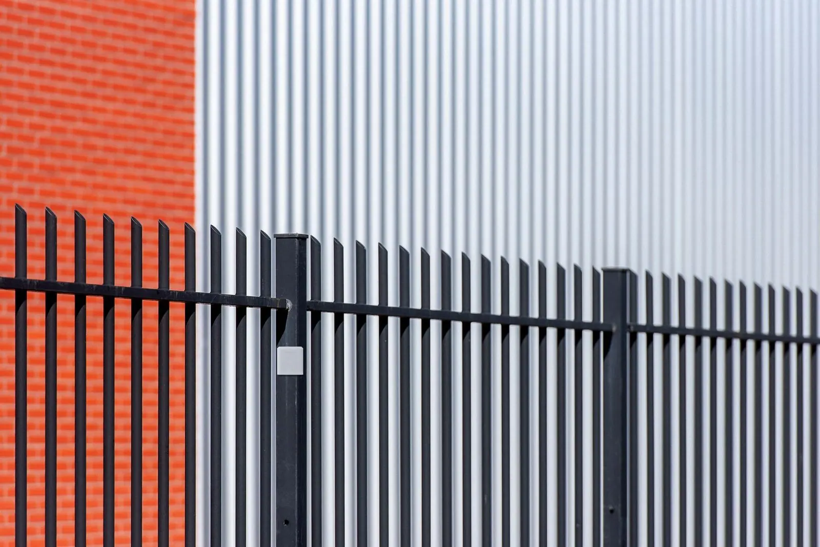 At a factory, on the boundary that faces the neighbours